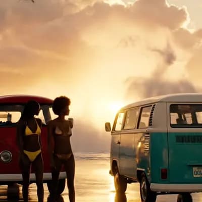 AI generated video: two classic vw split window buses are parked in a row on a glistening beach with large translucent ,...