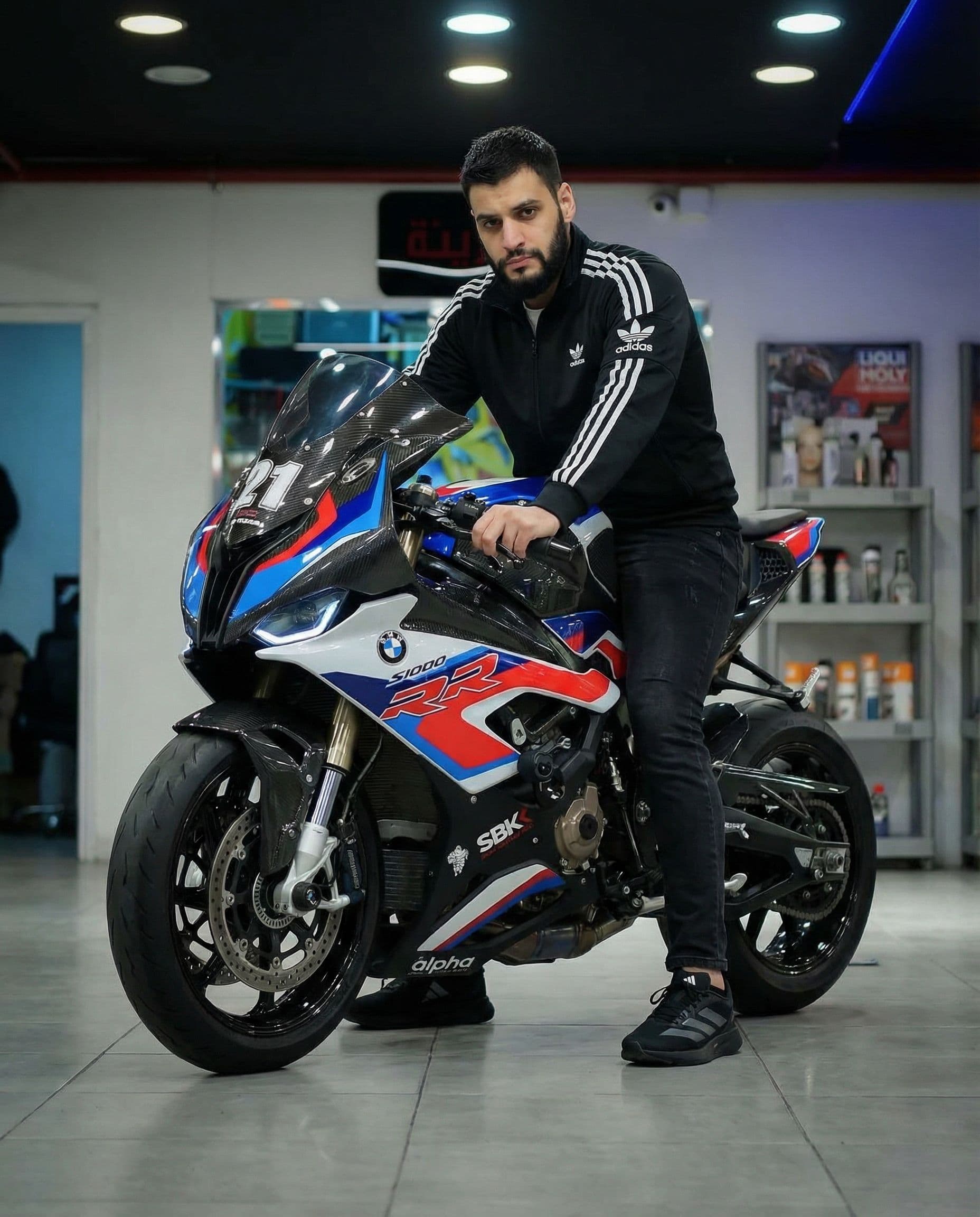 AI generated: Adding me on a bike that uploaded wearing black Adidas ( originals ) jack, black jeans and black Adi...