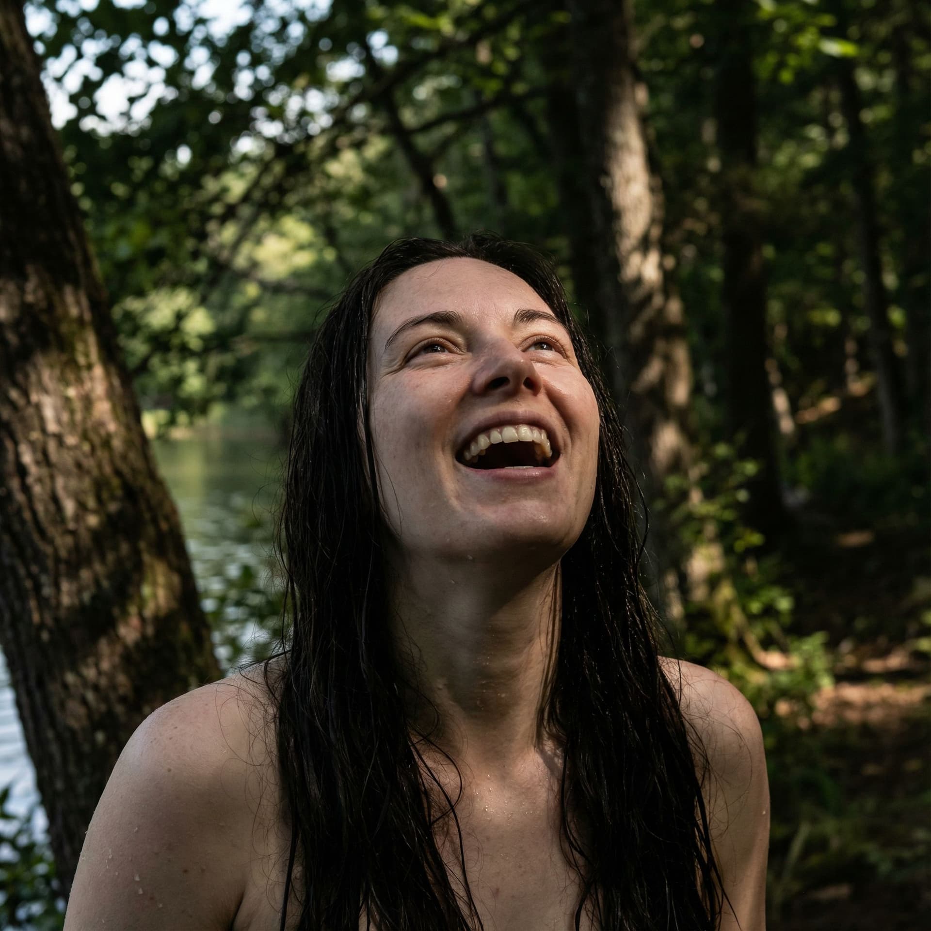 AI generated: ((hyper realistic)), 4k, (ultra-detail micro textures), fully naked, in a forest near a natural lake...