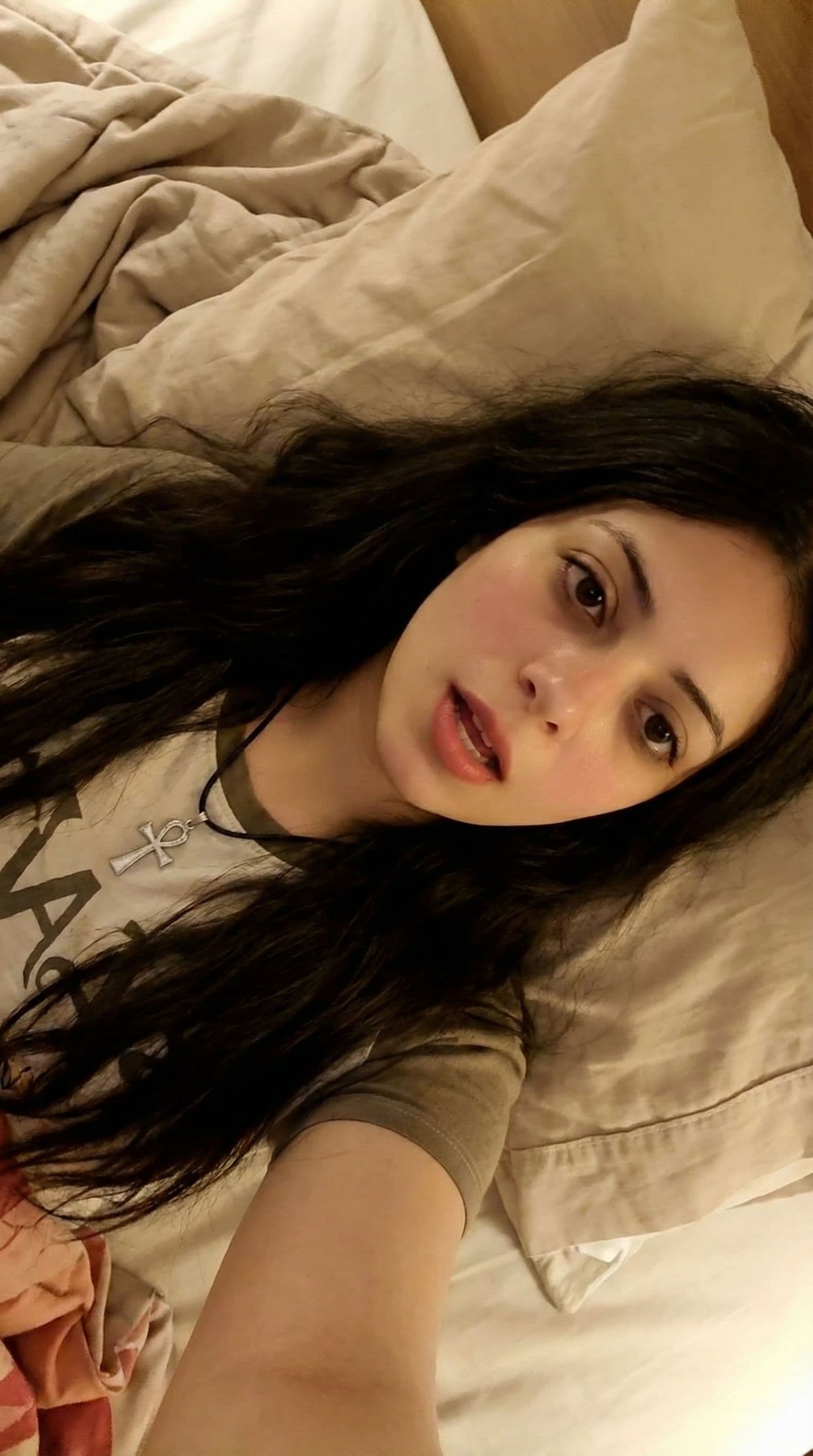 AI generated: photo realistic:2.0 masterpiece highest quality photograph realistic girl on bed mouth_open_moaning ...
