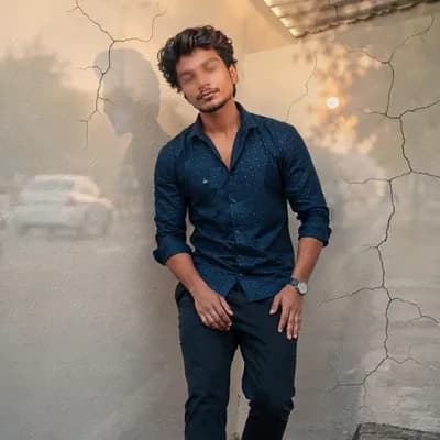 AI generated video: A young man with dark hair, wearing a blue, long-sleeved button-up shirt with small white polka dots...