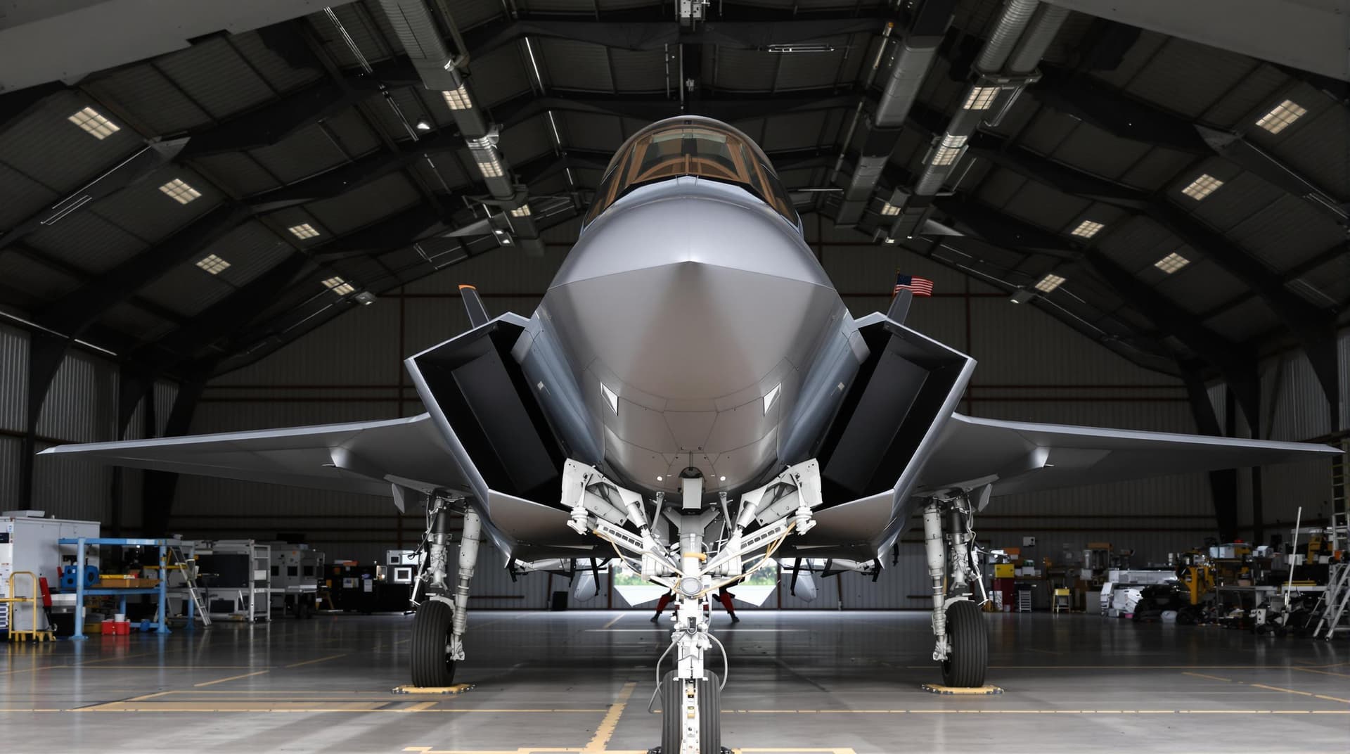 AI generated: A highly realistic F35 fighter jet sat on the ground at RAF Marham in a hangar, low shot 
