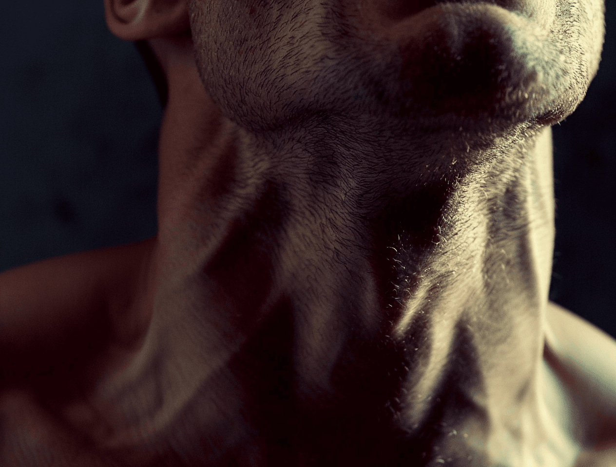 AI generated: Close up of an attractive muscular man's mouth, in the background is his torso and chest, home video...