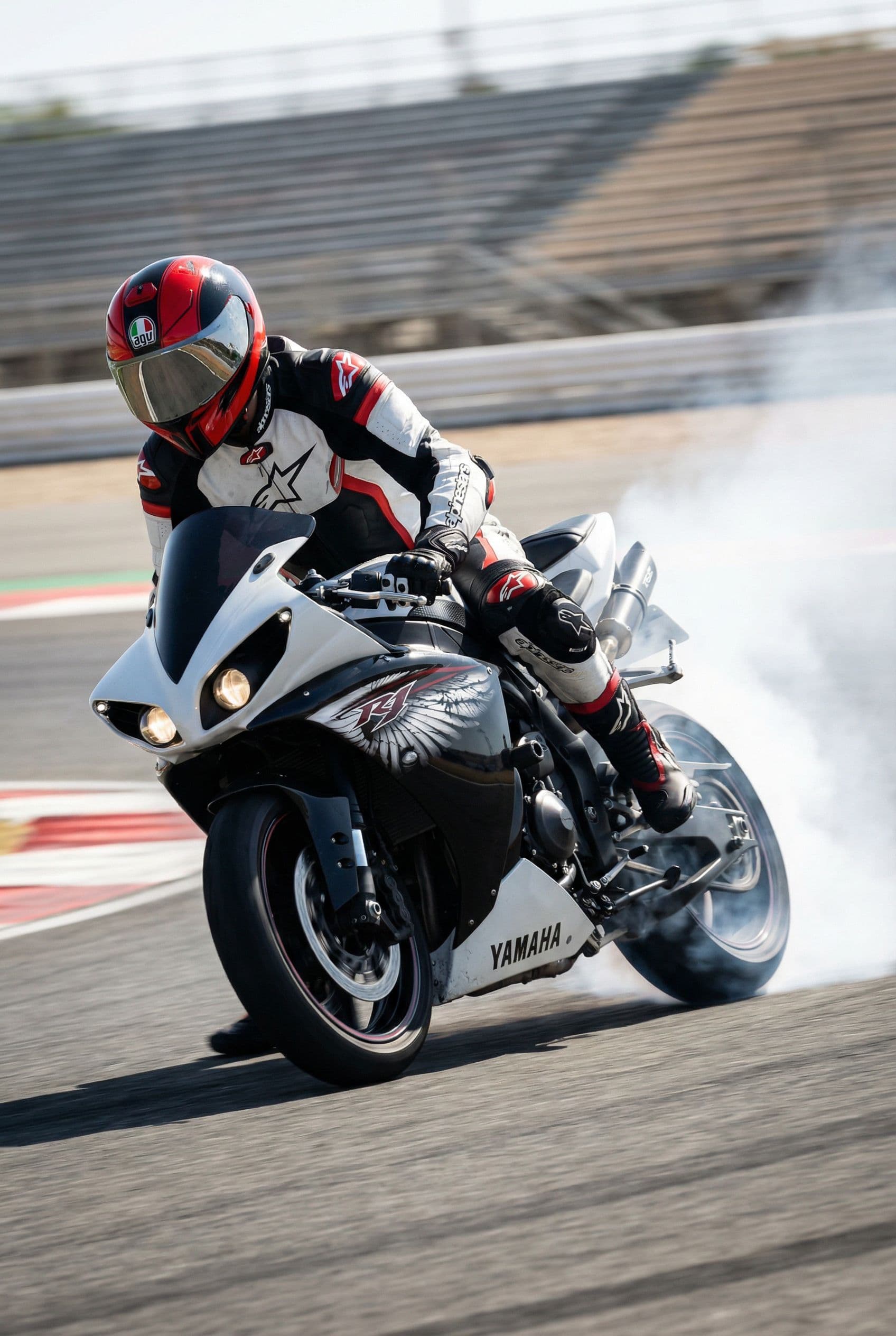 AI generated: A dynamic scene of a motorcyclist executing a sharp turn on a race track, showcasing the bike's powe...