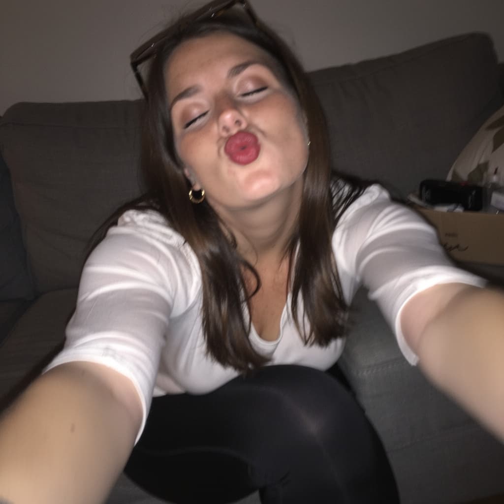 AI generated: Using the uploaded reference photo, create a standard iPhone selfie with flash. she is with eyes clo...