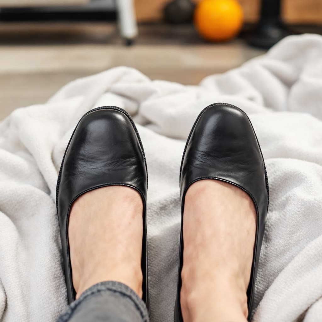 AI generated: feet in black leather flat shoes 