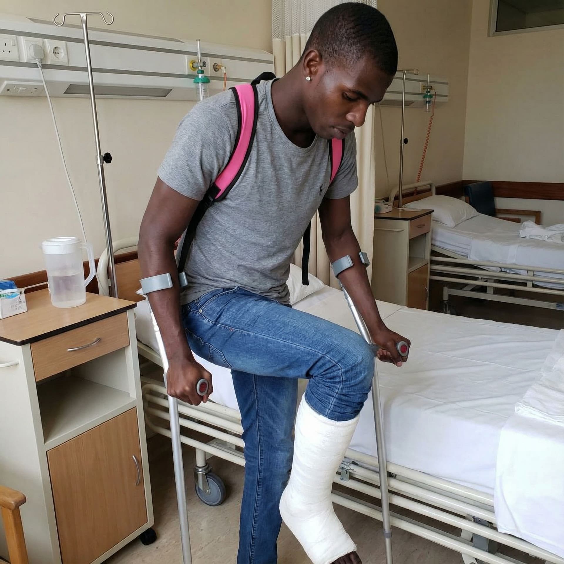 AI generated: Create the image; the character in this image should be on crutches getting out of a hospital bed wi...