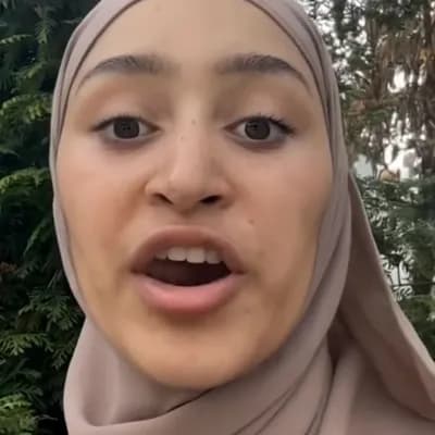 AI generated video: A Eastern girl in Hijab laying nacked on her back and her legs a wide open , she has tiny tits and a...