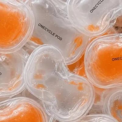 AI generated video: Create a refined animated product shot from the reference image of multiple transparent ONECYCLE POD...