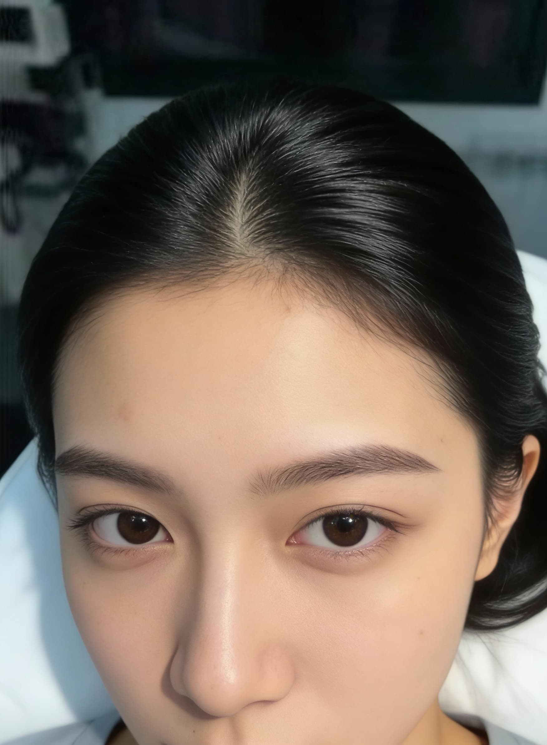 AI generated: focus on a black and silk hair of a girl setting in a dermatologist clinic laying her face down to s...