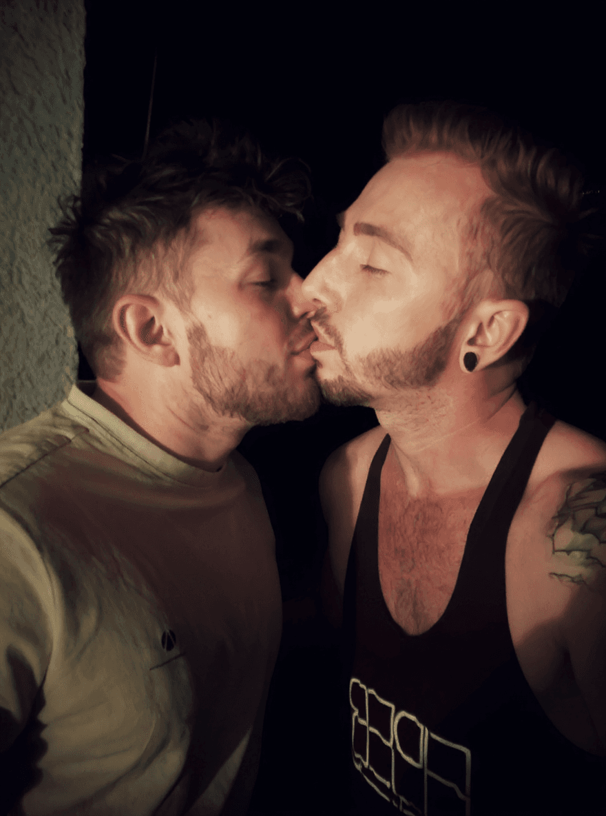 AI generated: The guys exchange a passionate kiss