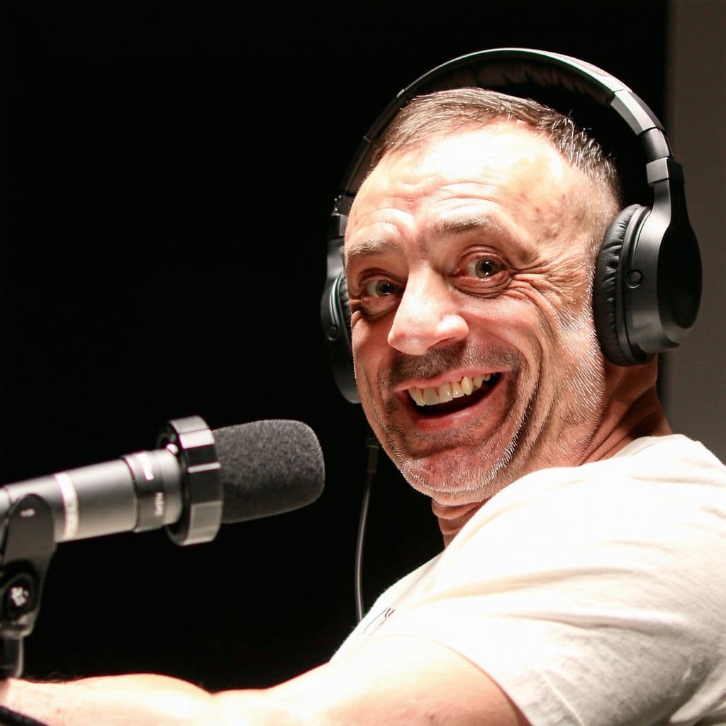 AI generated: Joe Rogan catches hitler breaking onto his set during a podcast and welcomes him