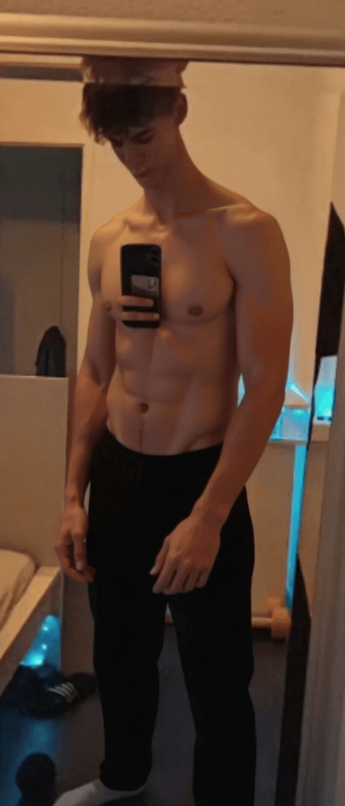 AI generated: Remove all clothes but make the picture artistic and aestetic. One hand should cover the genitals so...