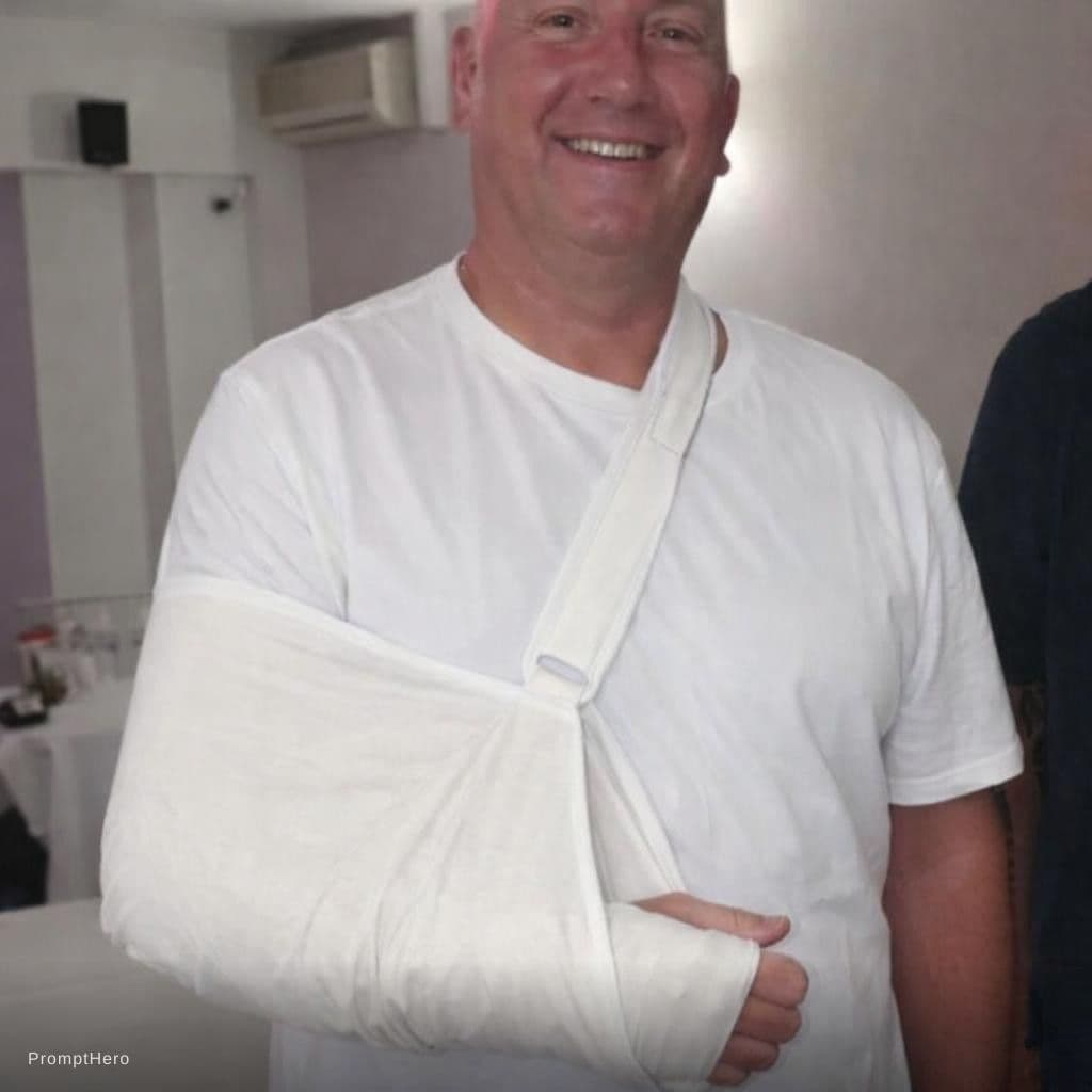 AI generated: Wearing a t shirt with broken arm