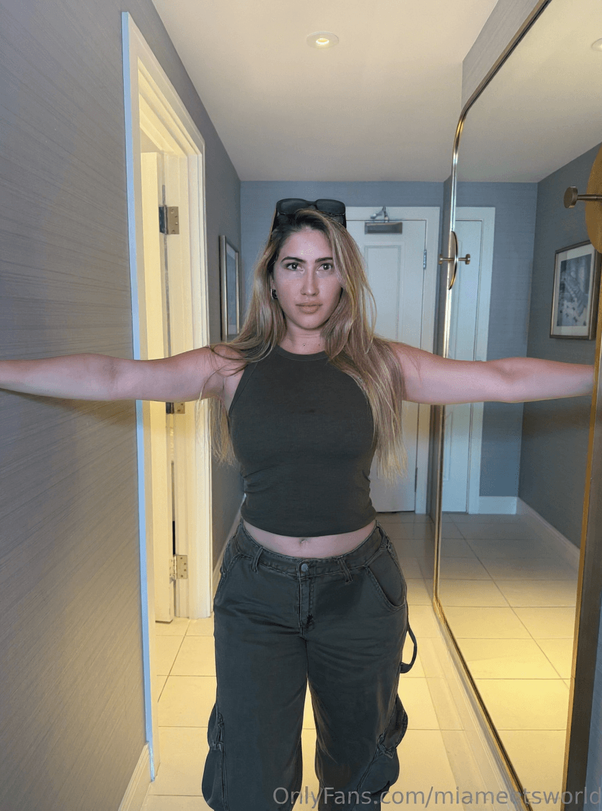 AI generated: Make her doing a frontal T-Pose (having her arms extended perfectly horizontal and her legs united) ...