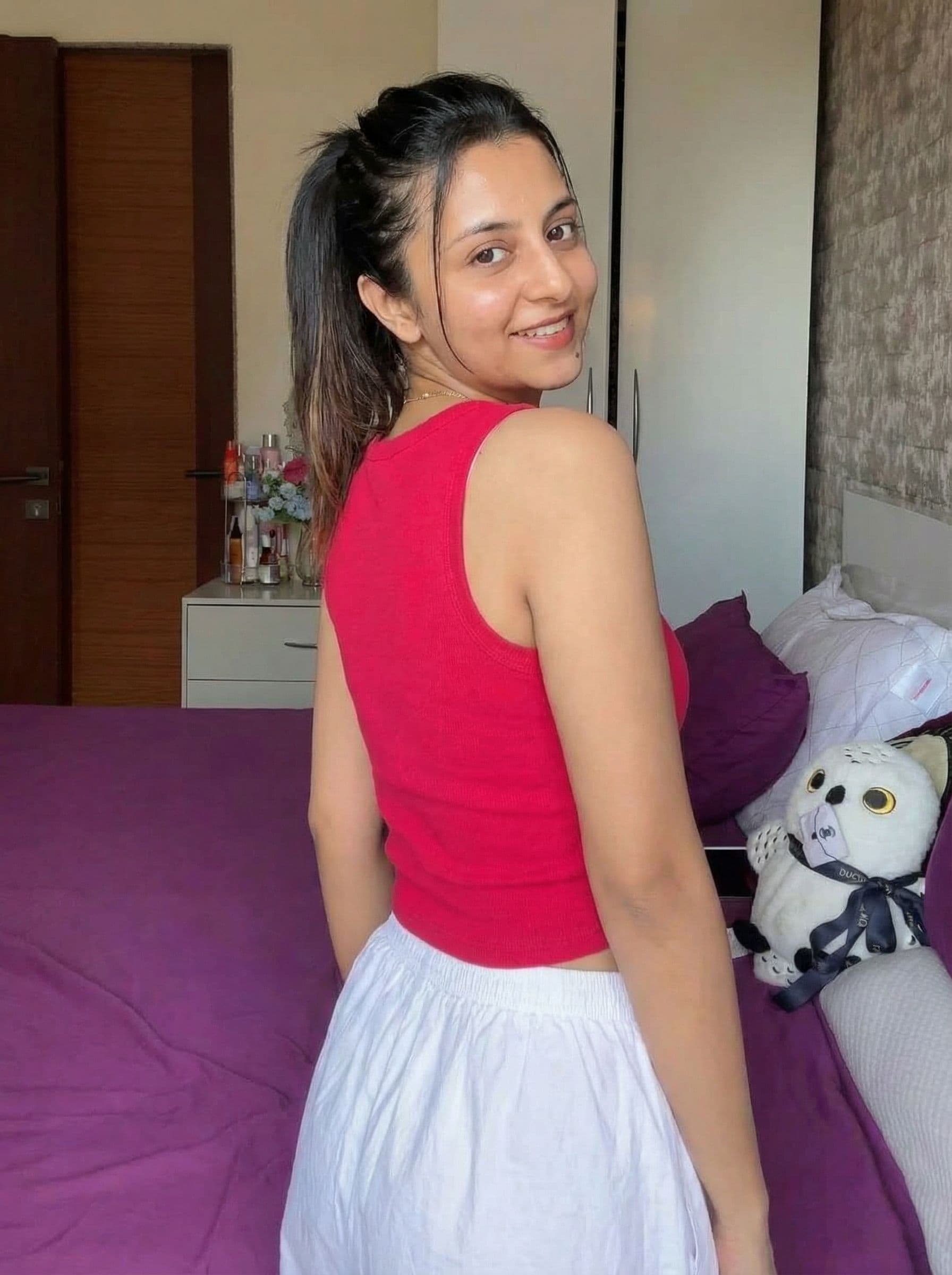 AI generated: 

show from rear camera angle walking away from camera looking back at camera. then turn around and ...