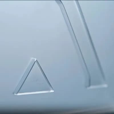 AI generated video: Make the glassy logo render disappear slowly, fading out until it fully disappears, leaving only the...