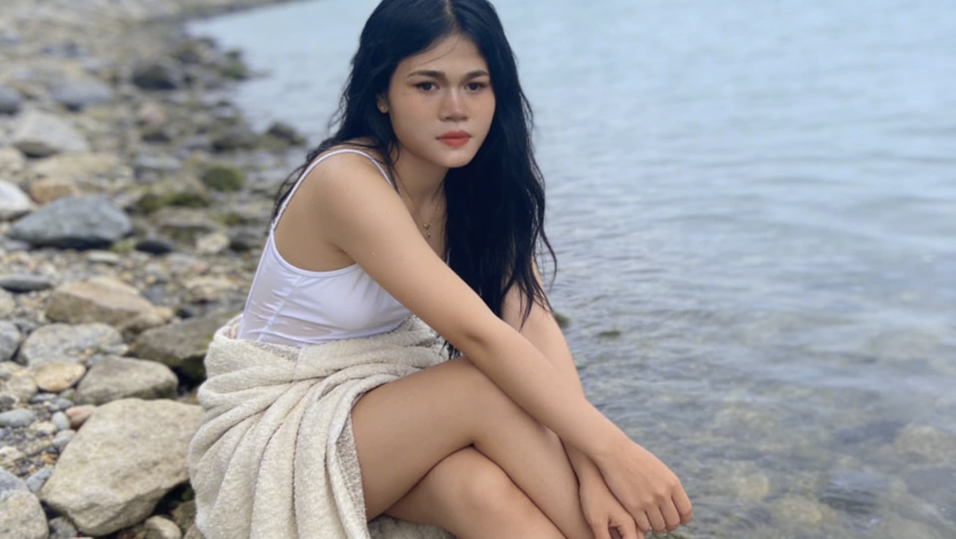 AI generated: A picture of two thighs crossed with hands and covered with a blanket photo enhanced. 