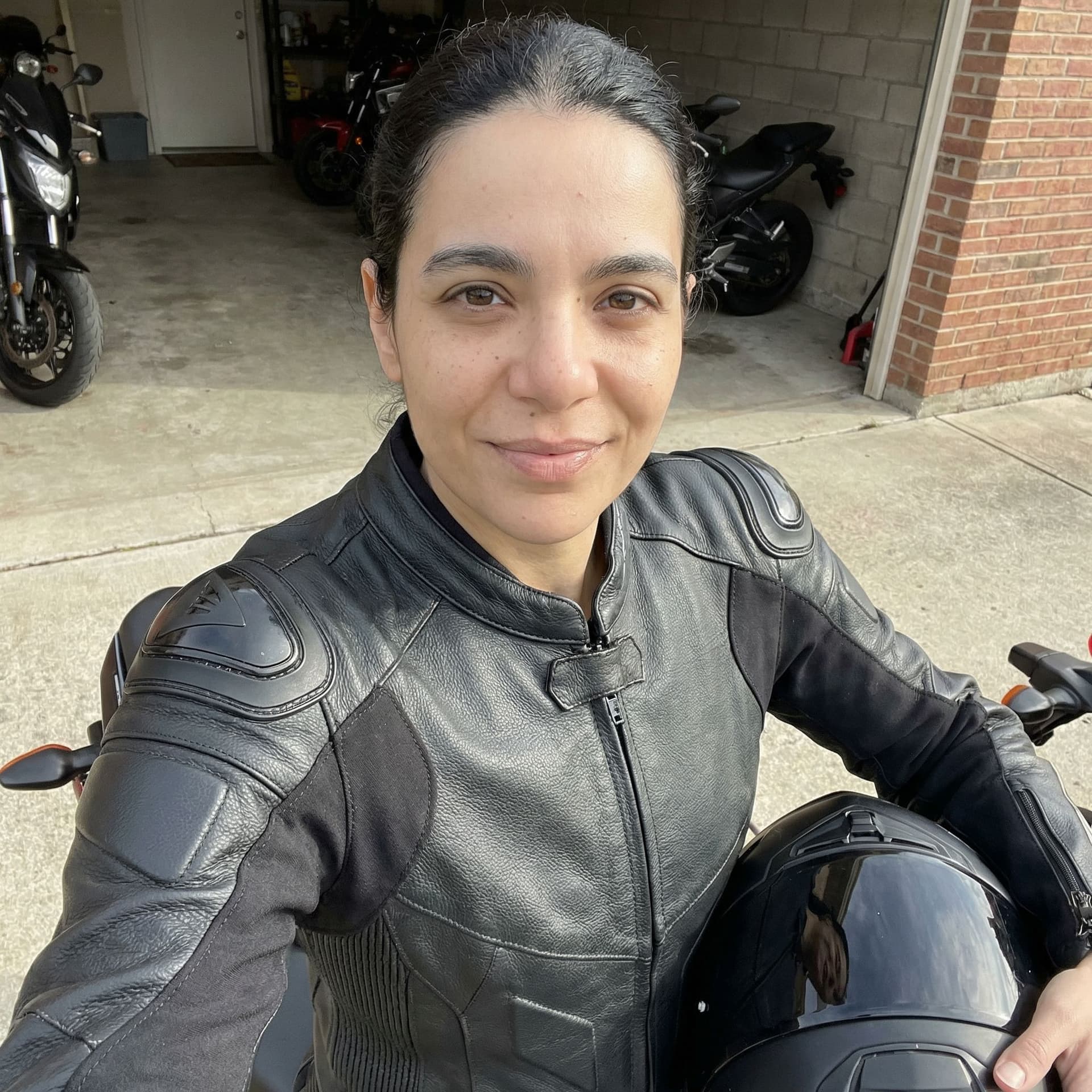 AI generated: Added me wearing black motorcycle suit