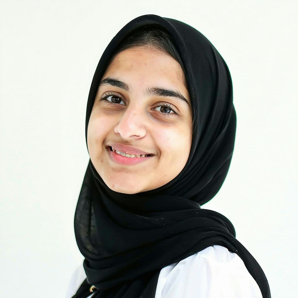 AI generated: young pakistani 30 years woman, gentle smile but don't show teeth, close shot, ((standing before the...