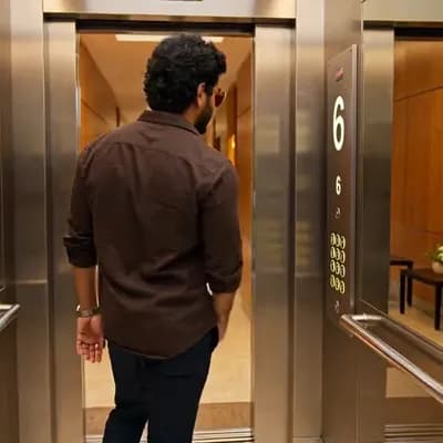 AI generated video: A continuous cinematic scene across multiple camera cuts.
A stylish young Indian man with curly hair...