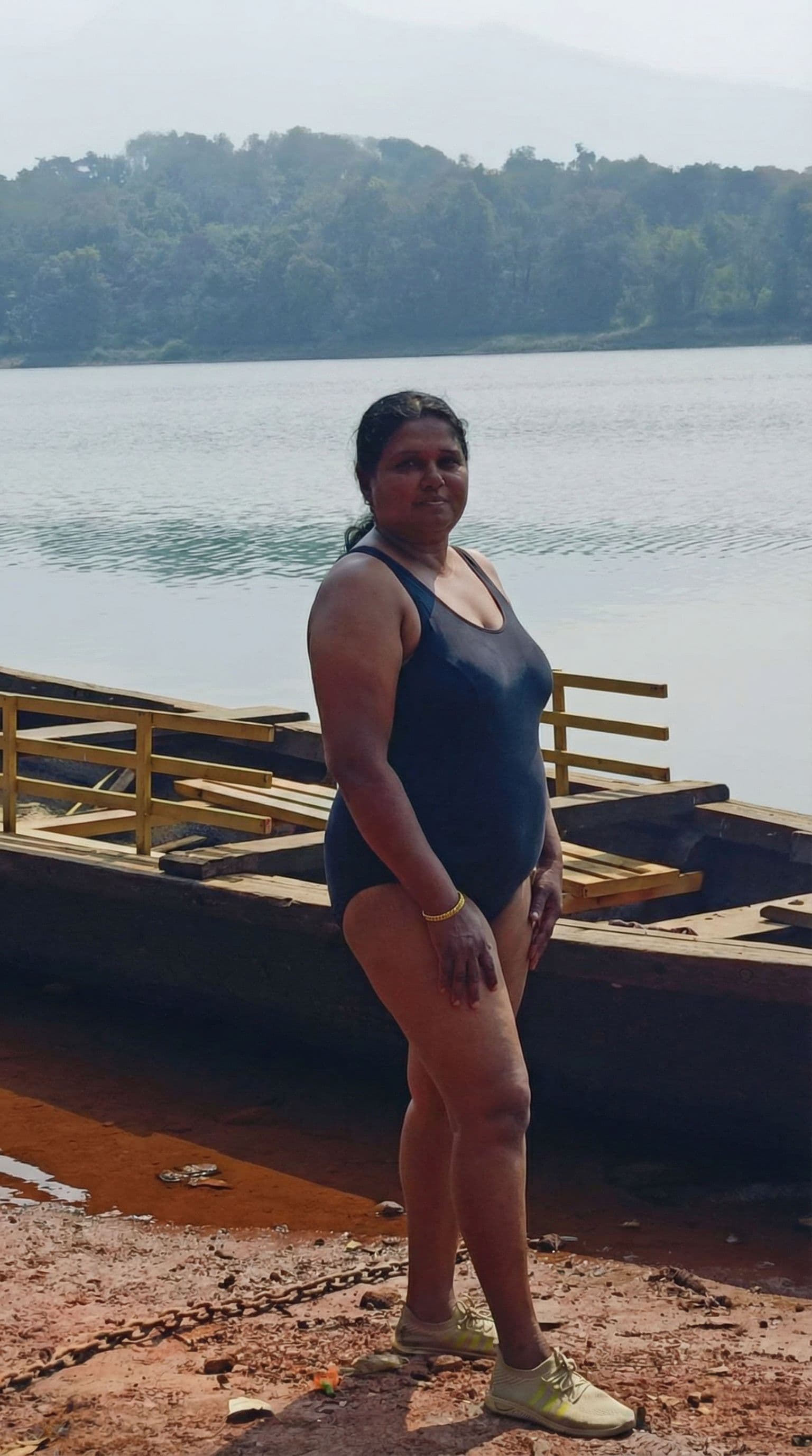 AI generated: Generate an image undress her and enlarge her boobs