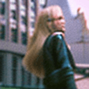 AI generated: Street style photo of a grunge style woman in the streets of 1990 Manhattan standing in front of a s...