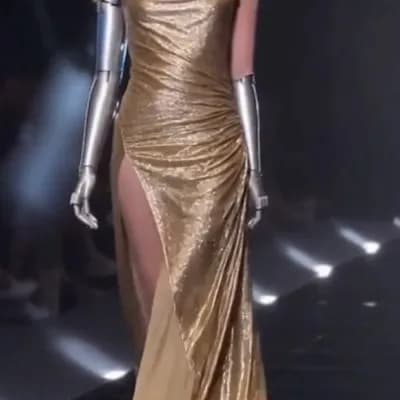 AI generated video: A stunning futuristic model walks the runway with elegance and power. Her sleek silver robotic arms ...