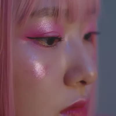 AI generated video: Show a close-up of a young, pale, beautiful Korean girl with K-pop pink makeup. Her eyes remain full...