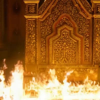 AI generated video: King throne very rich motives, golden, burning down, in flames, lots of movement and color 