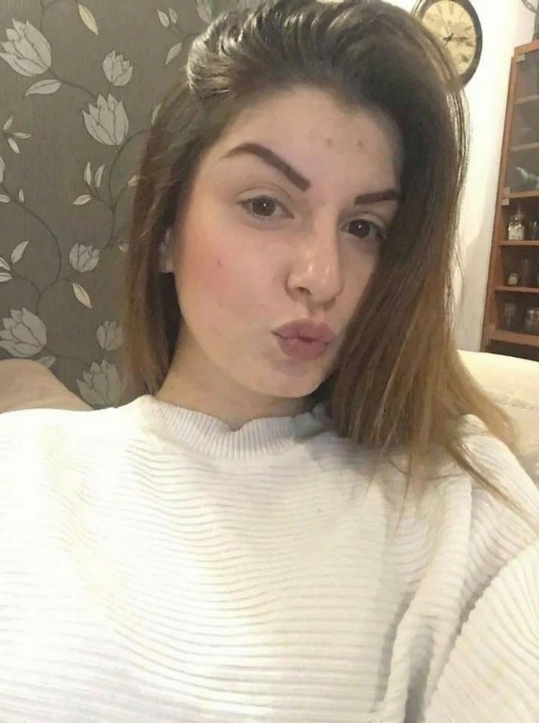 AI generated: let girl in this image make kissy lips