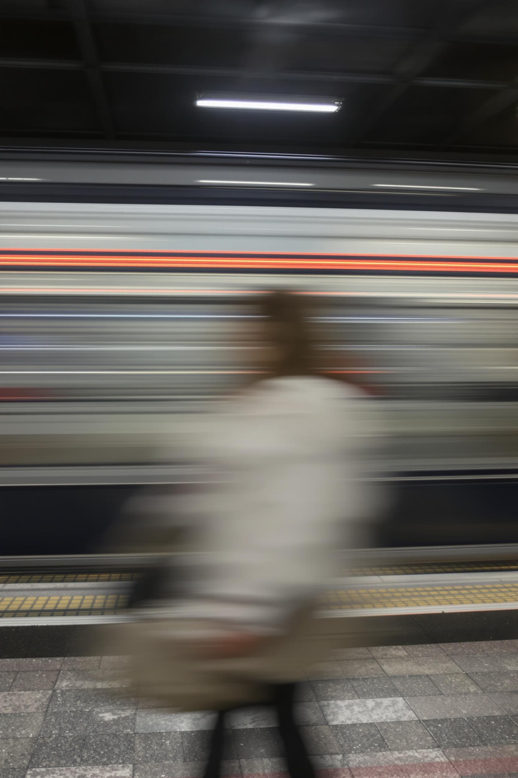 AI generated: conceputal image, commercial, rapid red line theme, wide shot, passing by woman blurring, simplify.