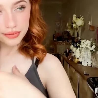 AI generated video: camera pans out quickly, she  removes her top is completly topless naked and reveals her big saggy b...