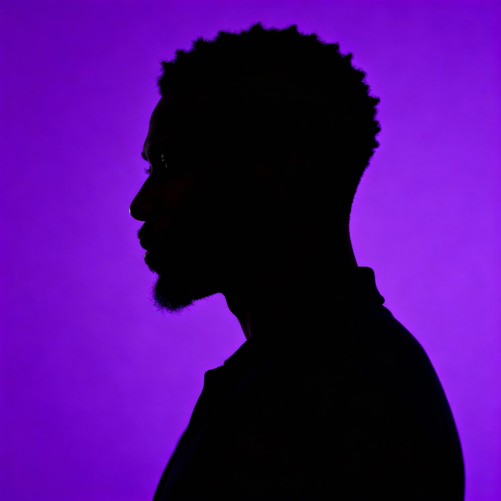 AI generated: photography, portrait of contrast, profile silhouette of a black man, vibrant purple backdrop, visua...