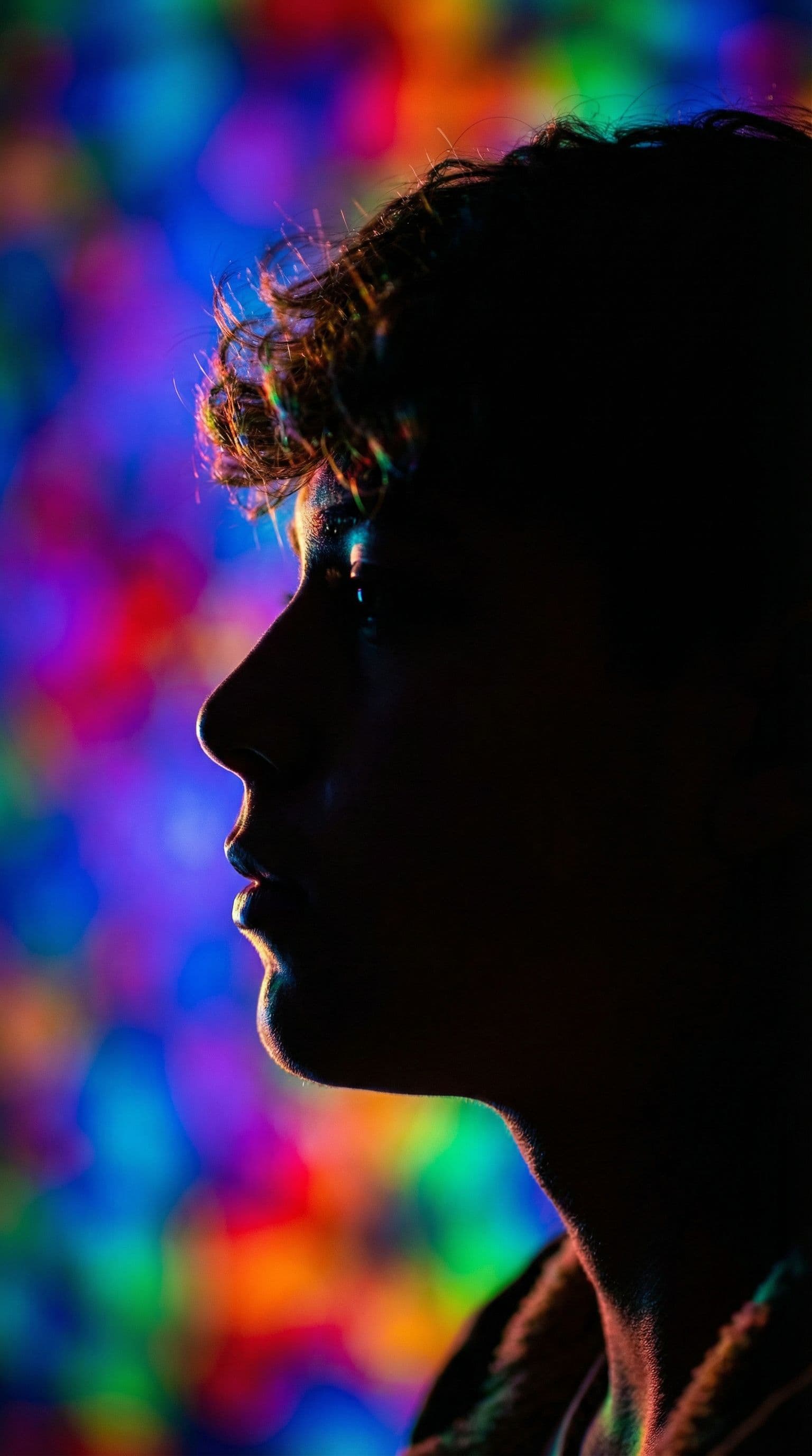 AI generated: photography, portrait. power of contrast, man model profile silhouette of a vibrant randomly color b...