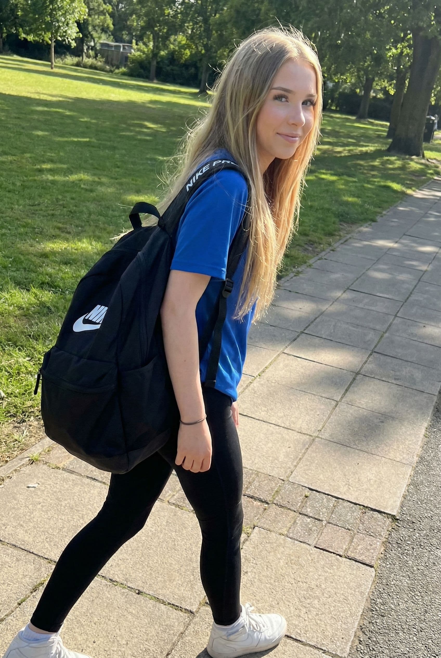 AI generated: Blonde Nike pro girl