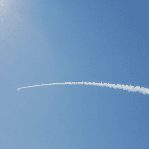 AI generated: A bright light blue sky with clear cloud, written a word 'CO2' the '2' is small, with airplane smoke...