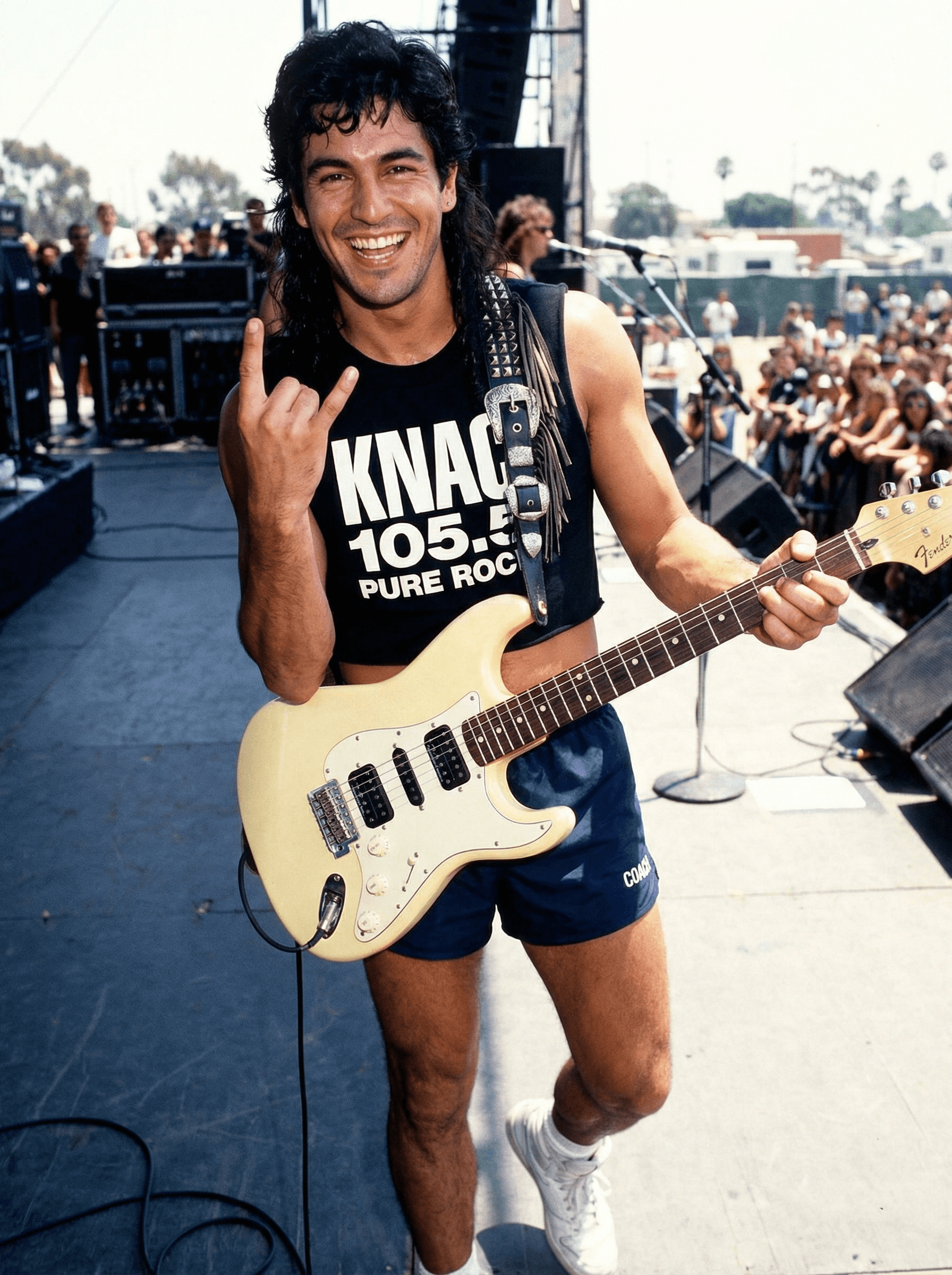 AI generated: Guitar player looks and smiles and gives a heavy metal sign with his left hand at the camera as he p...