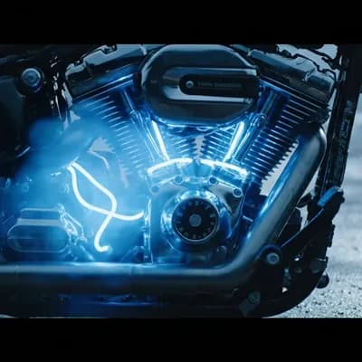 AI generated video:  Close-up of the engine
(Image attached for reference: Custom Harley-Davidson with neon blue lights...