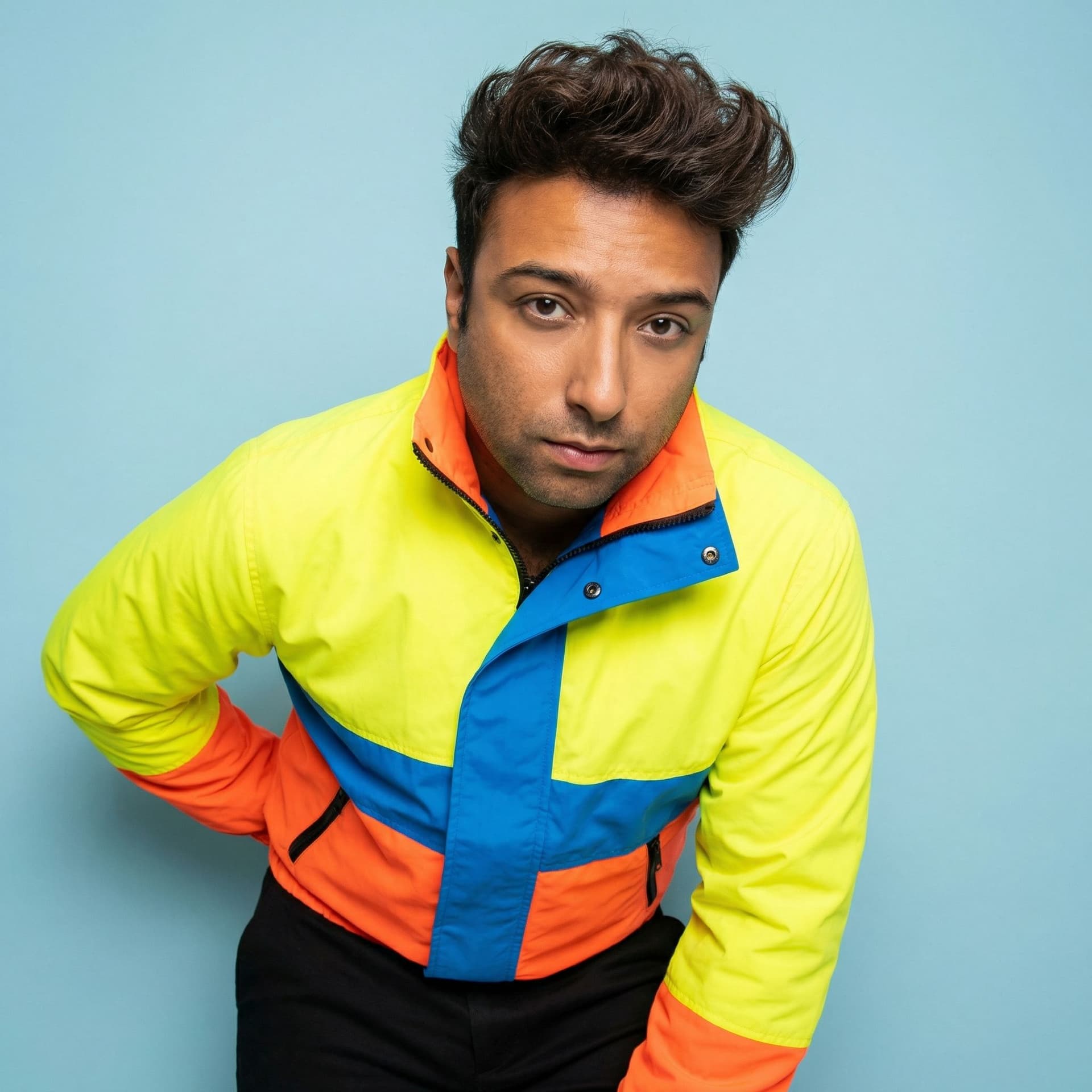 AI generated: High-fashion pop artist portrait in studio, wearing bold designer outfit. Strong pose with hand on h...