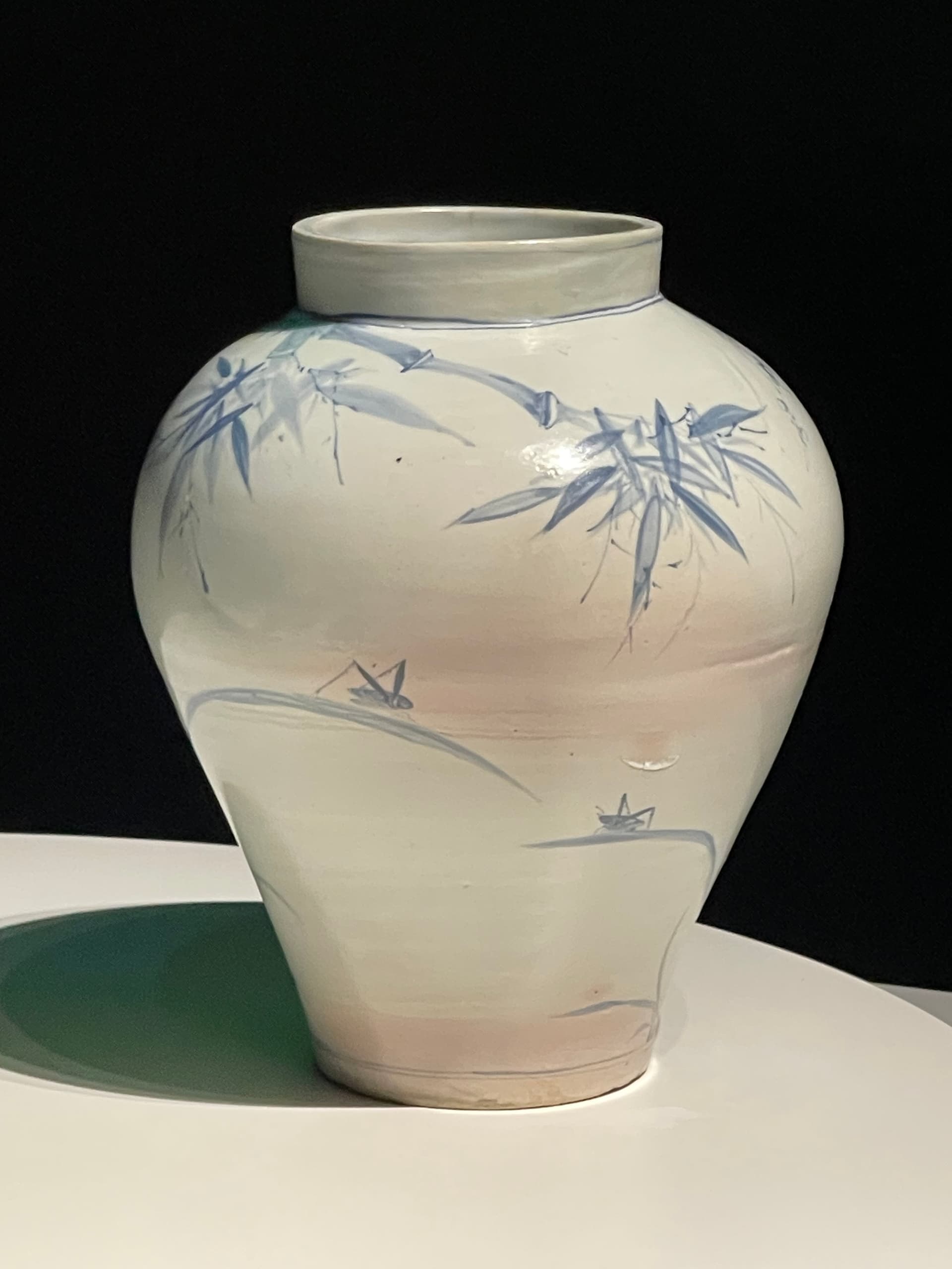 AI generated: The full moon shines this china bottle in the back.