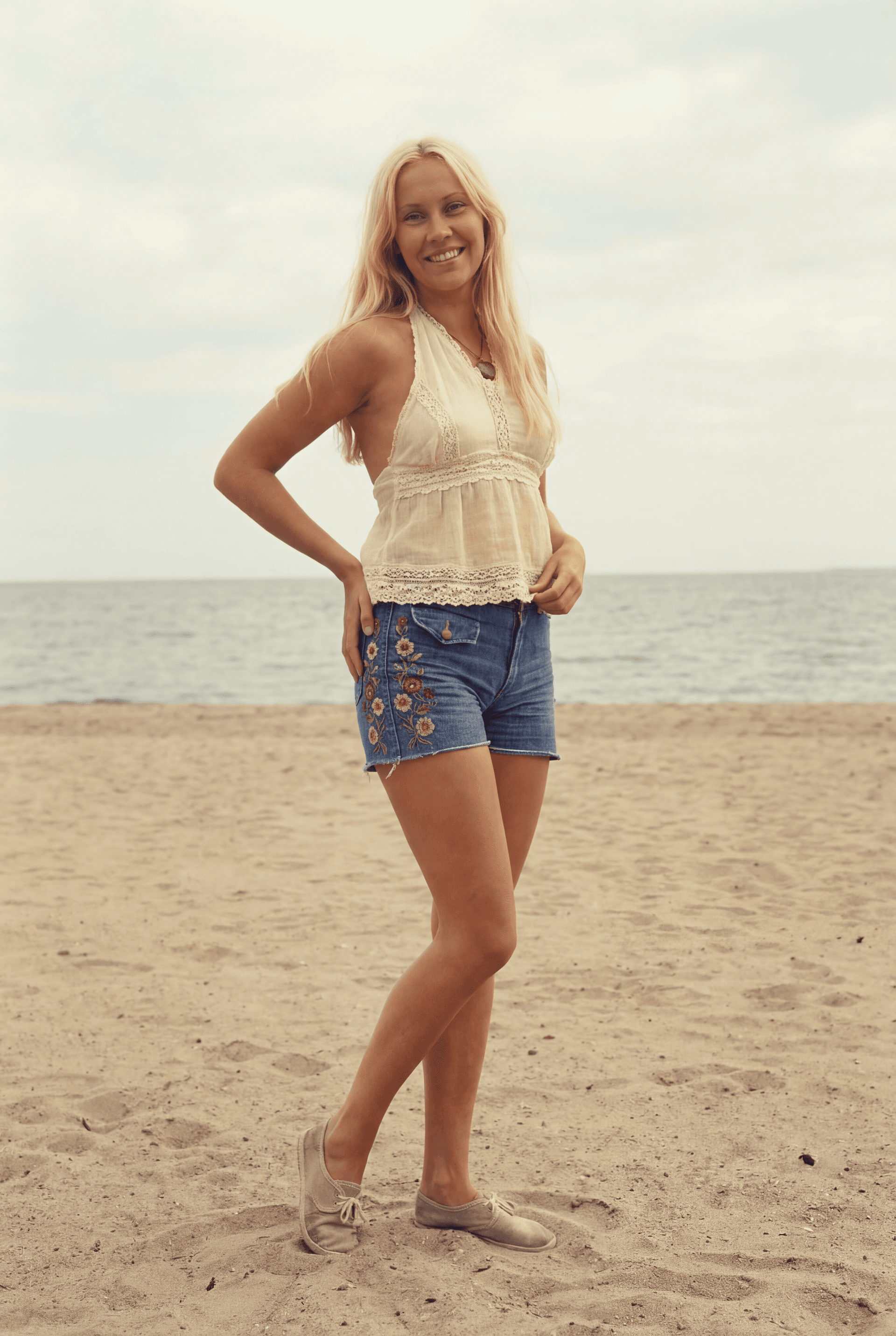AI generated: Please create a full length photo, in 1970s ABBA style, of a young thin slim smiling flat chested Ag...