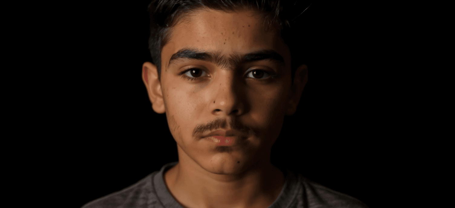 AI generated: editorial photography, front shot, upper-body, 8 years old boy model, gaze, capturing a bright light...
