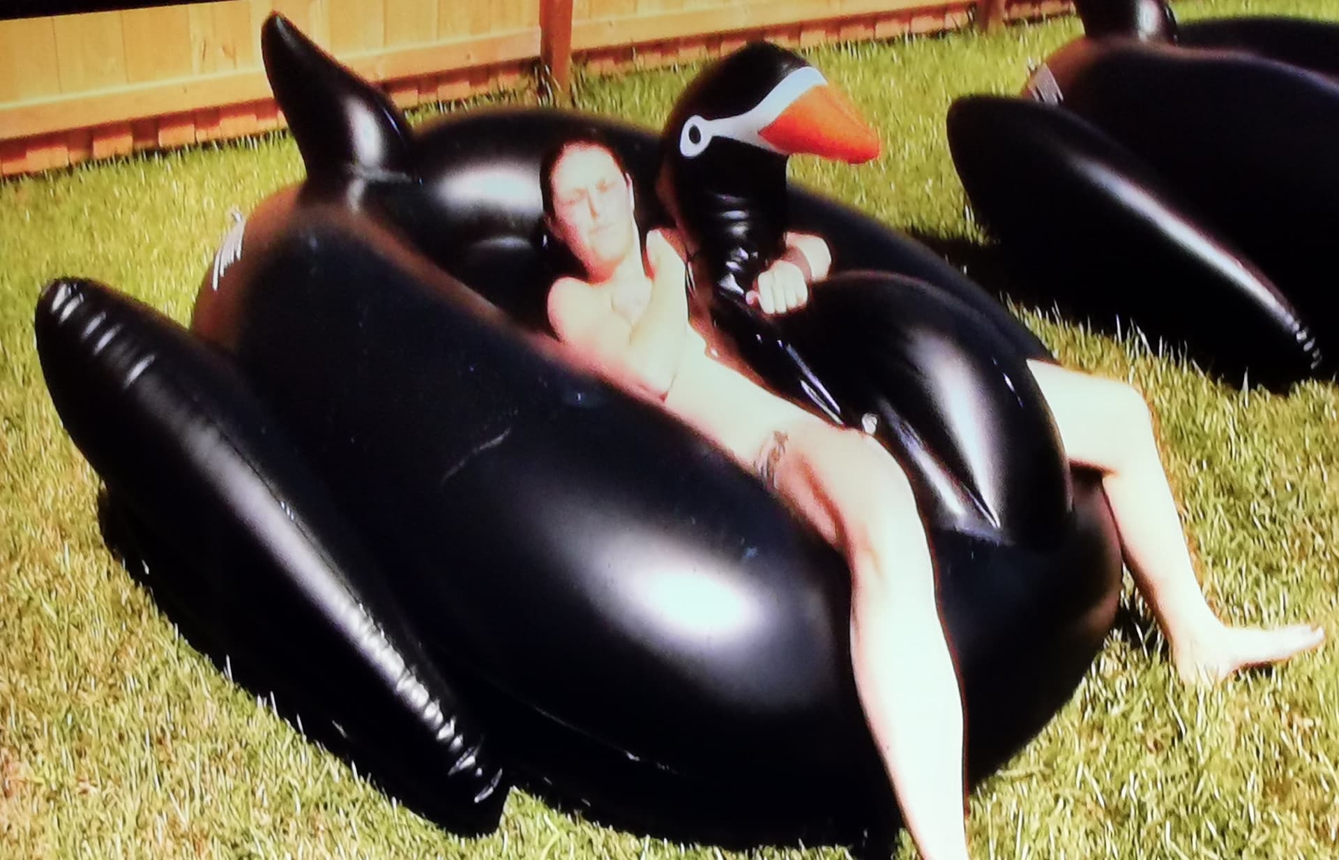 AI generated: woman sexy nude humping the giant inflatable black cushion 