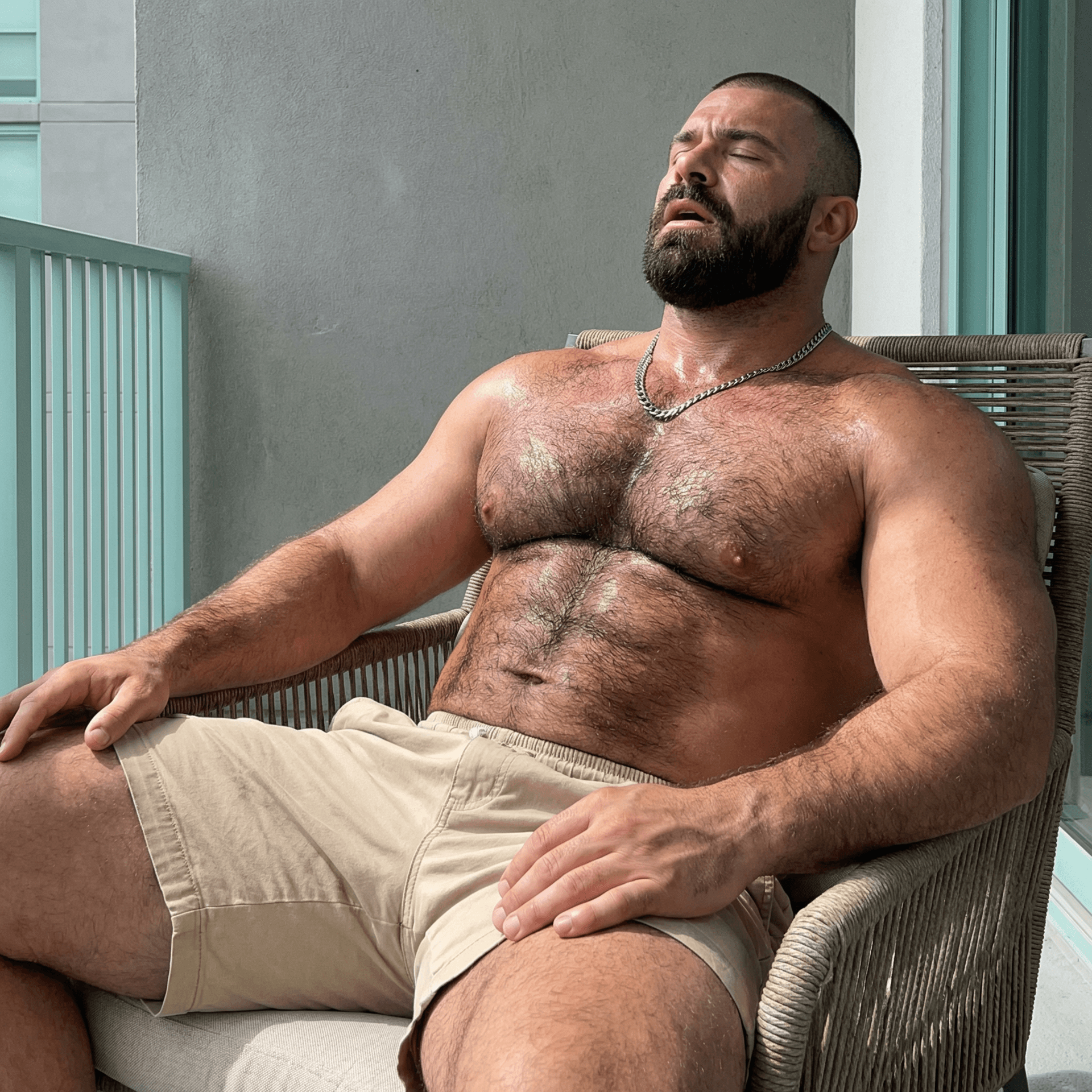 AI generated: "Hyper-realistic candid photograph or video still of a ruggedly handsome, heavily muscular man in hi...