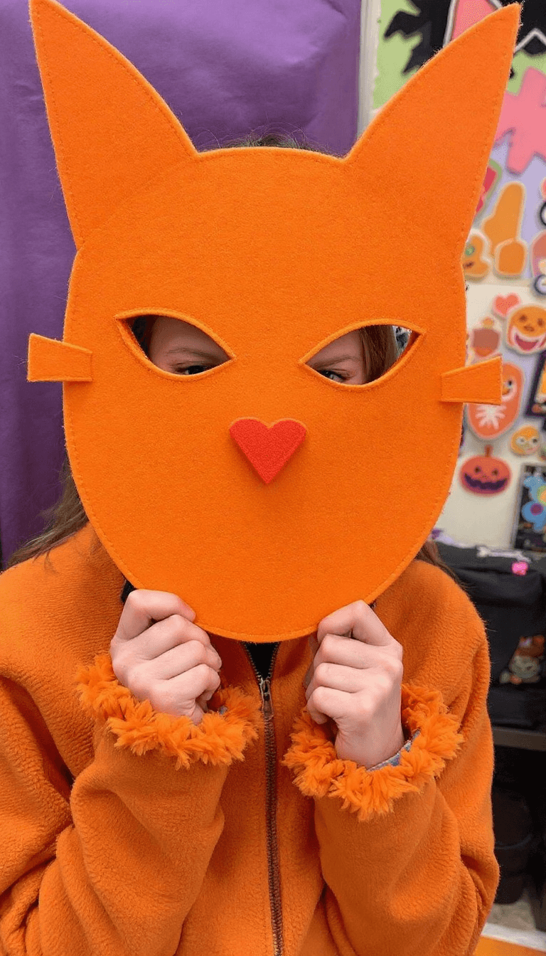AI generated: "This year everyone is wearing a clever felt 'mask' and orange is the only suitable colour."