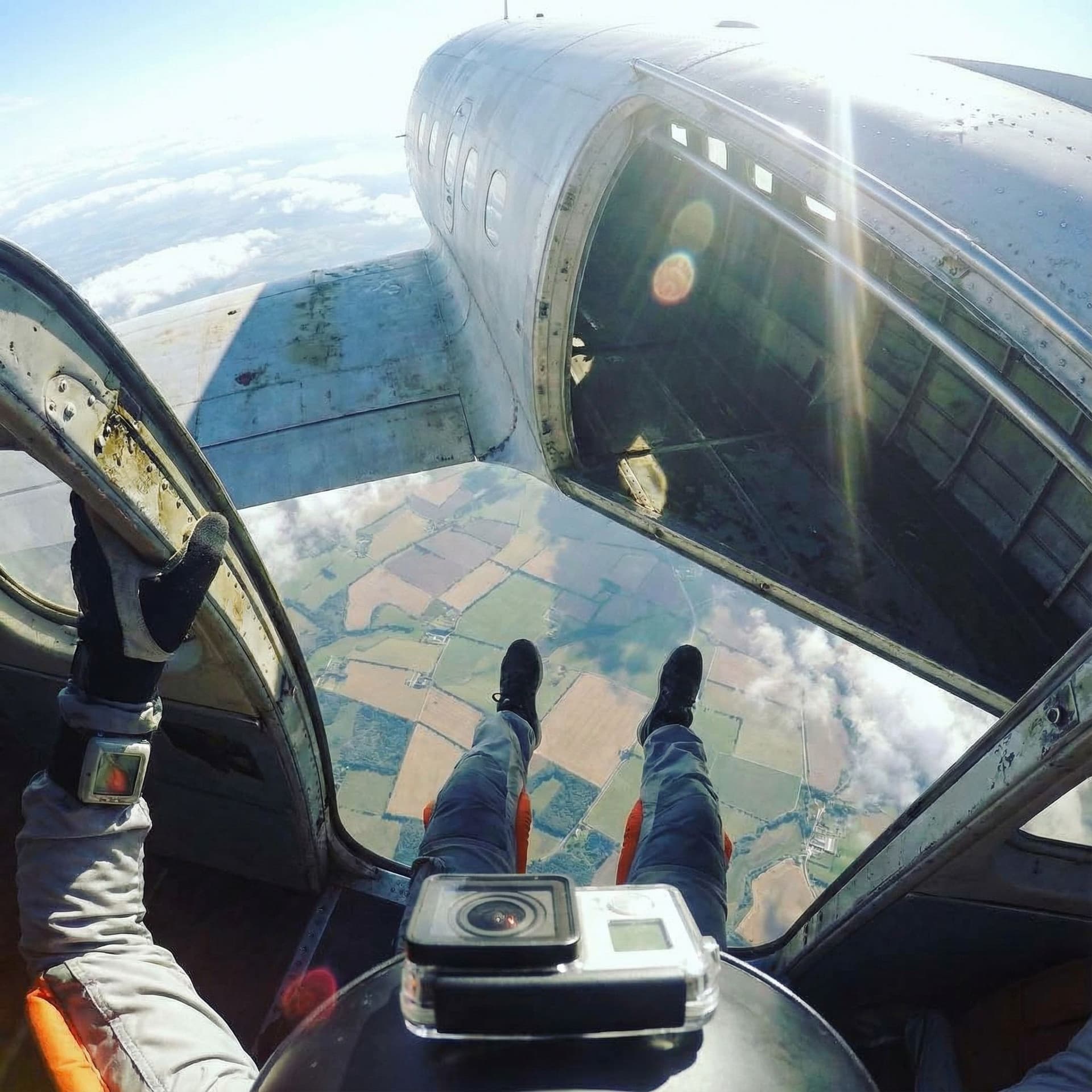 AI generated: A hyper-realistic GoPro POV shot from the edge of an airplane door