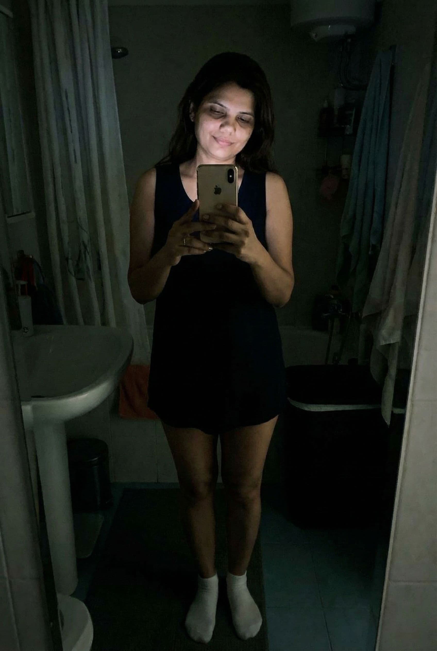 AI generated: Romantic iPhone full mirror body selfie,a sloppy snapshot. on a bathroom at night (no lights, wearin...