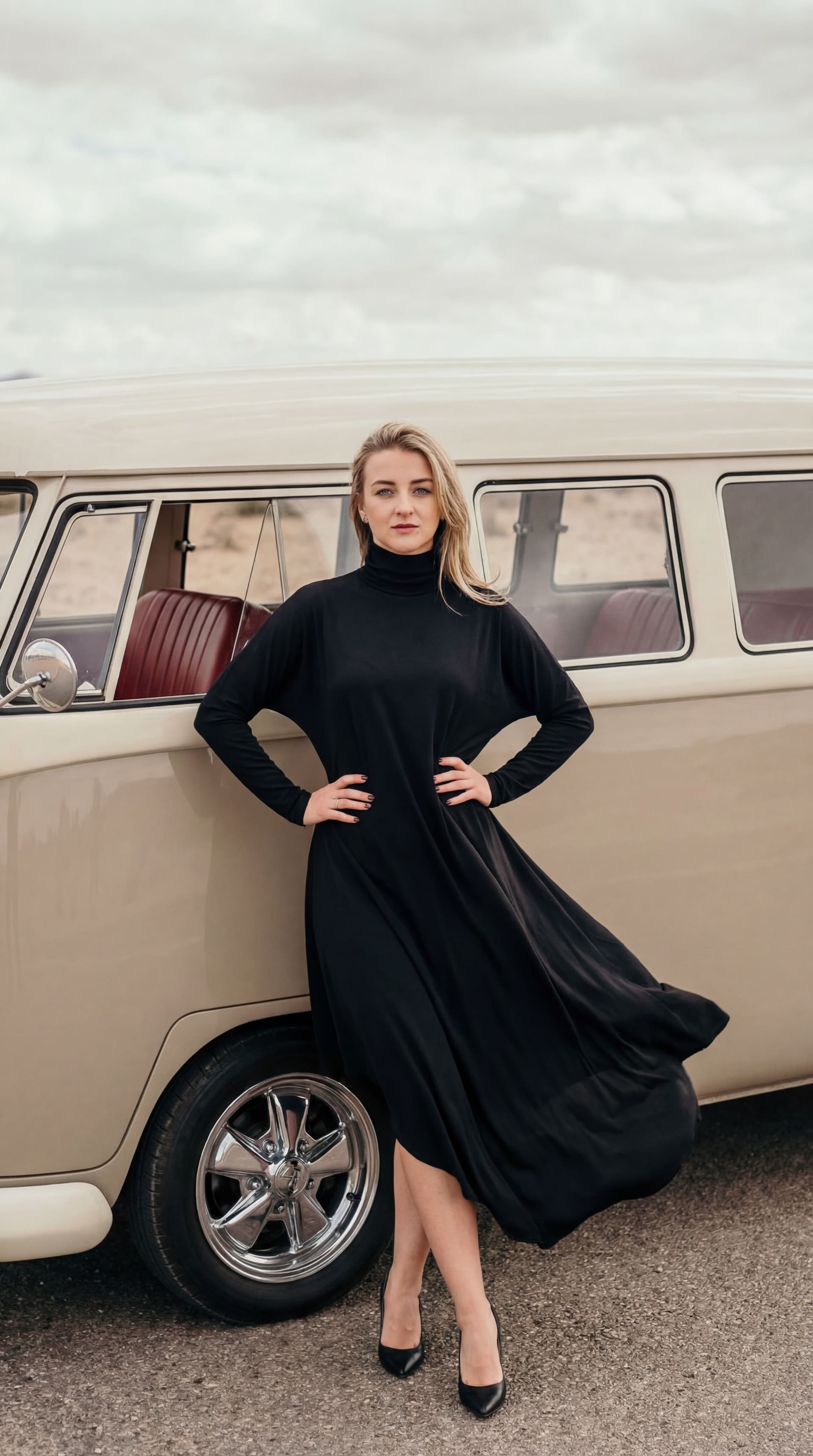AI generated: High-fashion editorial photography,a blonde girl with blue eyes standing confidently in front of a v...