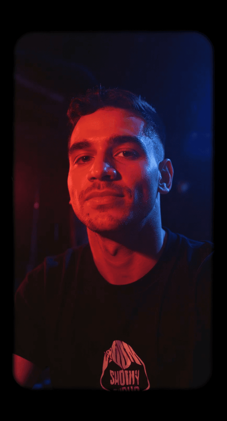 AI generated: fashion editorial, a portrait of young man is studio red and blue lights in style Alain Laboile, hig...